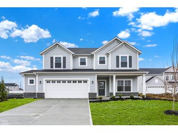 Charming two-story home with gray siding, black shutters, and a well-manicured lawn at 5777 Greenbrier Ct, Brownsburg, IN 46112