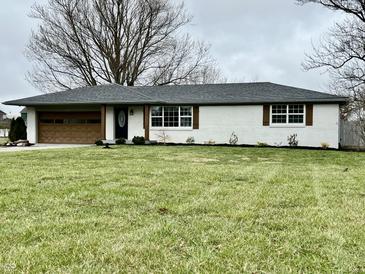 Charming single-story home featuring a well-manicured lawn and inviting exterior accents at 7874 E County Road 200 N, Avon, IN 46123