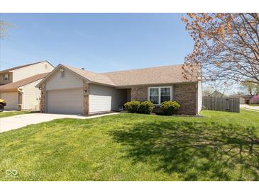 Charming single-Gathering home with a well-maintained lawn, attached garage, and beautiful landscaping at 12929 Shandon Ln, Fishers, IN 46038