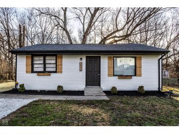 Charming home with white siding, wood shutters, manicured lawn, and fresh landscaping at 2835 S Lyons Ave, Indianapolis, IN 46241
