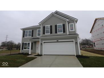 Charming two-story home with gray siding, black shutters, and an attached two-car garage at 3913 Highcrest Rd, Indianapolis, IN 46239