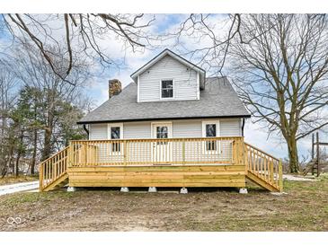 Charming two-story home featuring a new deck, light gray siding and a well-maintained yard at 435 N Chestnut St, Monrovia, IN 46157