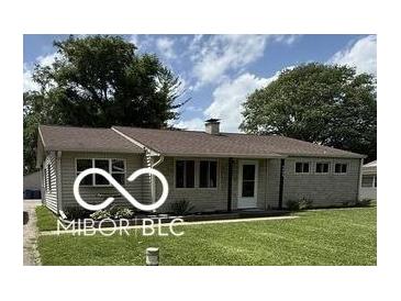 Charming single-story home featuring a well-maintained lawn and inviting front entrance at 4904 Betholm Dr, Indianapolis, IN 46239