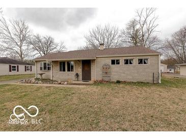 Charming single-story home featuring stone facade and well-maintained front yard landscaping at 4904 Betholm Dr, Indianapolis, IN 46239