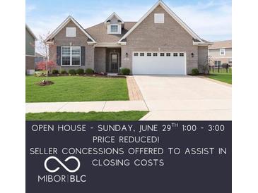 Charming single-story home featuring a brick facade, well-manicured lawn, and a two-car garage at 981 Mound St, Bargersville, IN 46106