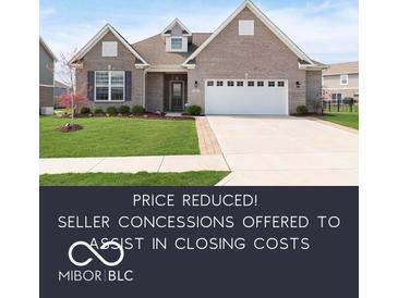 Charming single-story brick home with a well-manicured lawn and two-car garage at 981 Mound St, Bargersville, IN 46106