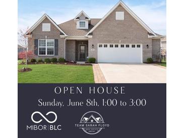 Charming single-story home with manicured lawn and a two-car garage, inviting front entrance, and brick facade at 981 Mound St, Bargersville, IN 46106