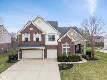 Beautiful two-story brick home with a two-car garage and professionally landscaped front yard at 2091 Banburry Pl, Avon, IN 46123