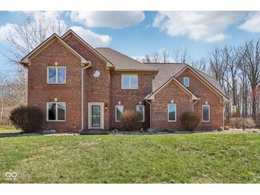 Charming two-story brick home with a well-manicured lawn and a classic, inviting facade at 2525 Sunderland Dr, Martinsville, IN 46151