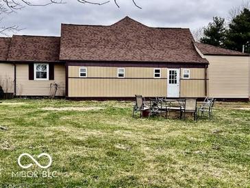 View of the backyard with a patio set, showing the exterior of the house at 7154 S 325 W, Jamestown, IN 46147