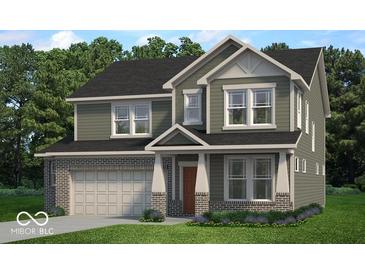 Charming two-story home featuring neutral siding, brick accents, and welcoming front porch at 4777 E Summerfield Dr, Camby, IN 46113