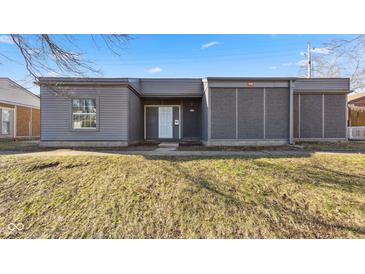 Charming single-story home with gray siding, front lawn, and a welcoming front door at 3661 Yellow Poplar Ct, Indianapolis, IN 46222
