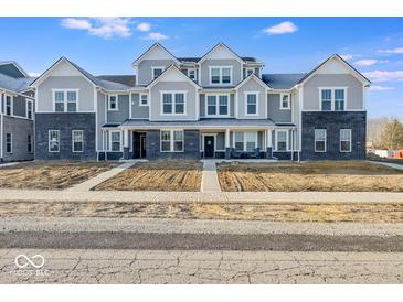 New construction townhome featuring gray siding, black brick, and covered porches in a modern style at 5771 Cr W 750 N, McCordsville, IN 46055