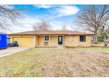 Charming stone ranch home with an attached garage and well-maintained front yard at 5984 Williams Dr, Plainfield, IN 46168