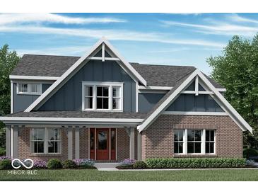 Charming two-story home featuring a brick facade, inviting front porch, and gable roof design at 6887 Oakdale Ln, Avon, IN 46123