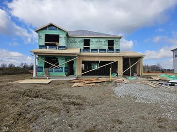 New two story home under construction with visible framing and green weather barrier on a sunny day at 2242 Oakmont Dr, Plainfield, IN 46168