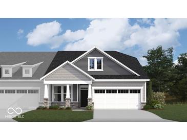 Charming home exterior with stone accents, inviting entryway, and a two-car garage at 268 Onset Way, Westfield, IN 46074