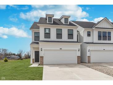 Beautiful two-story home featuring white siding, black-trimmed windows, and an attached two-car garage at 3308 Morab Dr, Zionsville, IN 46077