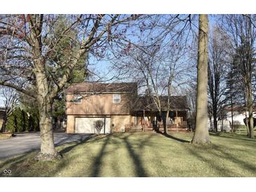 Charming two-story home with a well-maintained lawn and inviting front porch, perfect for enjoying the outdoors at 5819 Bar Del E Dr, Indianapolis, IN 46221