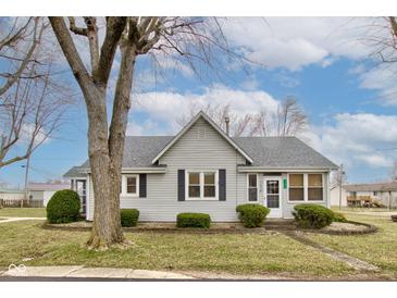 Charming single-story home with gray siding, neat landscaping, and a welcoming front entrance at 502 E Washington St, Summitville, IN 46070