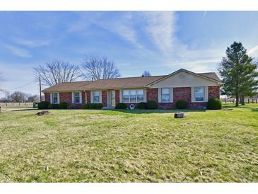 Charming one-story brick home featuring large windows and a well-manicured lawn at 3451 N County Road 100 E, Danville, IN 46122