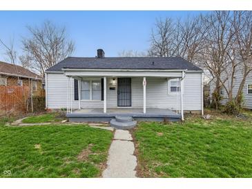 Charming single-story home featuring a covered front porch and a well-maintained lawn at 3710 Orchard Ave, Indianapolis, IN 46218