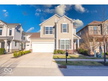 Charming two-story home with a well-manicured lawn and inviting curb appeal at 14241 Antiquity Dr, Carmel, IN 46033
