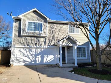 Charming two-story home with a well-maintained lawn, attached garage and concrete driveway at 2249 Grand Fir Dr, Greenwood, IN 46143