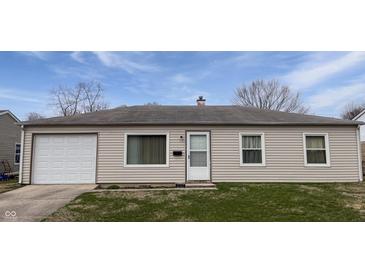 Charming ranch-style home with vinyl siding, attached garage, and well-maintained front lawn at 3540 N Norfolk St, Indianapolis, IN 46224