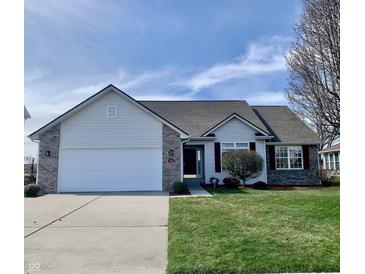 Charming single-Gathering home with a well-manicured lawn, attached two-car garage and brick accents at 4414 Princeton Park Dr, Columbus, IN 47201