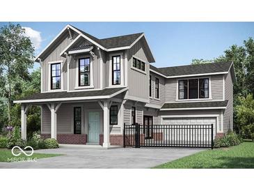 Charming two-story home with a covered porch, modern architectural design and manicured front yard at 13395 Vickery Ridge Dr, Fishers, IN 46037