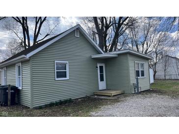 Charming single-story home with light green siding, white trim, and a small front porch entrance at 1904 S Rosemont Ave, Muncie, IN 47302