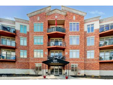 Beautiful brick condo building with private balconies and covered entrance at 20971 Shoreline Ct # 309, Noblesville, IN 46062