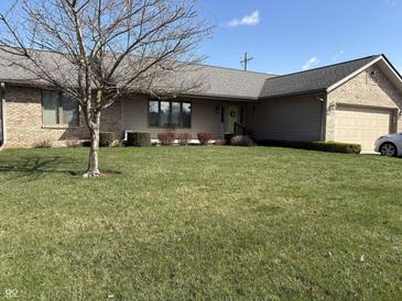 Charming single-story home with well-maintained lawn, attached garage, and neutral siding at 3760 Briar Hill Way, Columbus, IN 47203