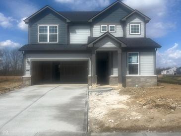 Charming two-story home featuring a two-car garage, gray siding, and a concrete driveway at 620 Corbin Way, Avon, IN 46123