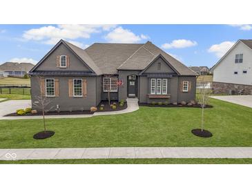 Charming single-Gathering home boasting a well-manicured lawn and inviting curb appeal at 18271 Lake Winds Dr, Westfield, IN 46074