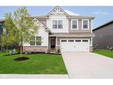 Beautiful two-story home with a well-manicured lawn and attached two-car garage, creating a welcoming curb appeal at 19992 Fenside Xing, Westfield, IN 46074