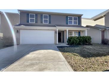 Charming two-story home with a two car garage and gray siding at 2350 Bridlewood Dr, Franklin, IN 46131