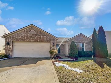 Charming single-story home with a two-car garage, brick facade, and well-maintained front lawn at 851 Pine Lake Dr, Greenwood, IN 46143