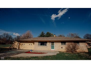 Charming brick home featuring a well-maintained front yard and a welcoming entrance at 6315 S Keystone Ave, Indianapolis, IN 46227