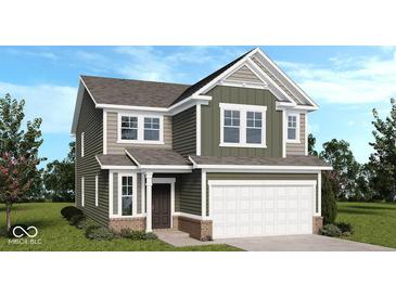 Charming two-story home with a two-car garage, green siding, and a well-manicured lawn at 8711 Hollander Dr, Camby, IN 46113