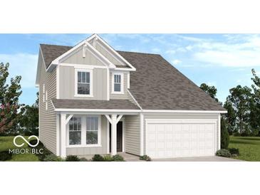 Charming two-story home featuring a two-car garage and gray siding at 1924 White Oak Ln, Shelbyville, IN 46176
