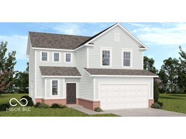 Charming two-story home with a brick-lined foundation, attached garage, and well-manicured lawn at 1952 White Oak Ln, Shelbyville, IN 46176