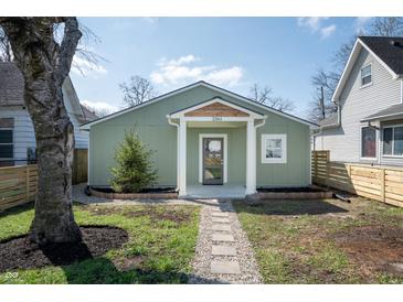 Charming home featuring new landscaping, sidewalk, and a covered entryway at 2361 Southeastern Ave, Indianapolis, IN 46201