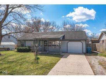 Charming ranch-style home featuring a covered front porch and an attached single-car garage at 4429 Tucson Dr, Indianapolis, IN 46241