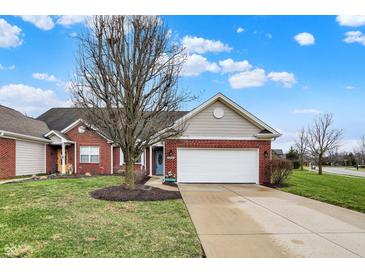 Charming brick home featuring a two-car garage, well-manicured lawn, and an inviting entryway at 3447 Heathcliff Ct, Westfield, IN 46074