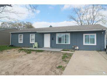 Charming single-story home with a simple yard and driveway at 5314 W 34Th St, Indianapolis, IN 46224