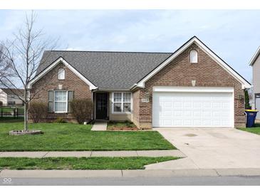 Charming single-story brick home with well-manicured lawn and attached two car garage at 6418 W Oxford Ln, McCordsville, IN 46055