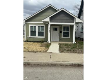 Charming craftsman home with a neatly landscaped front yard and inviting front porch at 1746 Lambert St, Indianapolis, IN 46221