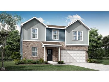 Charming two-story home with a brick and siding facade and a two-car garage at 2232 Foothill Dr, Greenfield, IN 46140